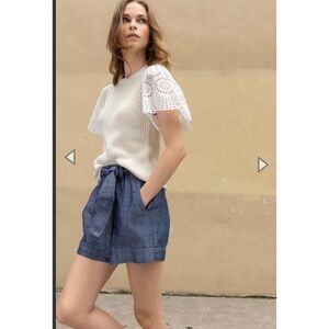 Lilla P crewneck sweater in navy has feminine eyelet sleeves🧵